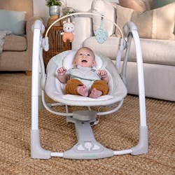 Ingenuity columpio para bebé Cozy Spot portátil con barra de juegos y música